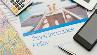 Concept art showing a travel insurance policy and a calculator 